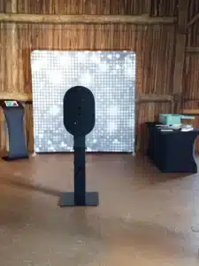 FastBooth photo booth with silver sequin backdrop at a barn venue