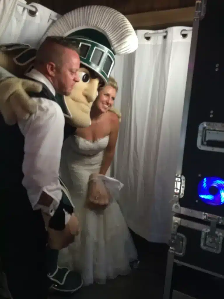 Wedding party striking fun poses in a FastBooth photo booth