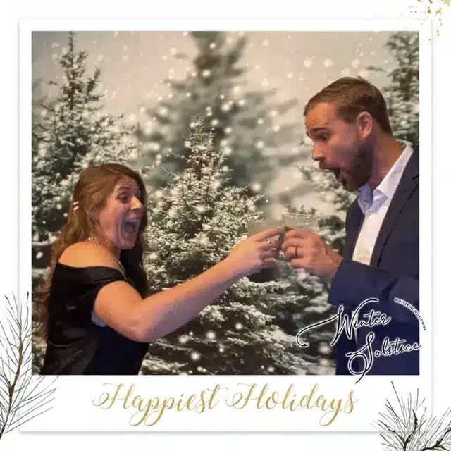 Winter Solstice holiday toast photo with festive backdrop